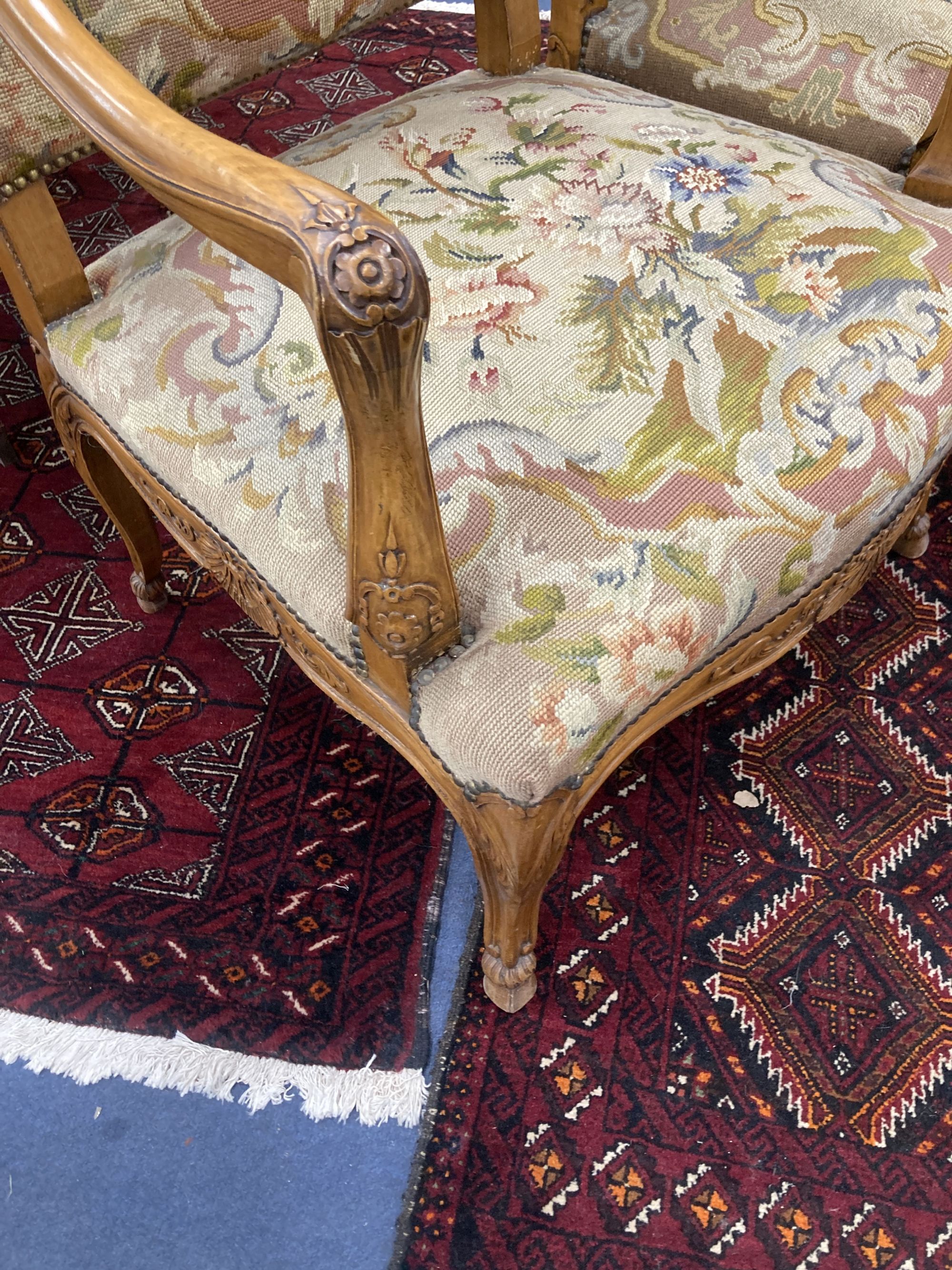 A pair of Louis XV style needlepoint armchairs, width 69cm, depth 60cm, height 110cm